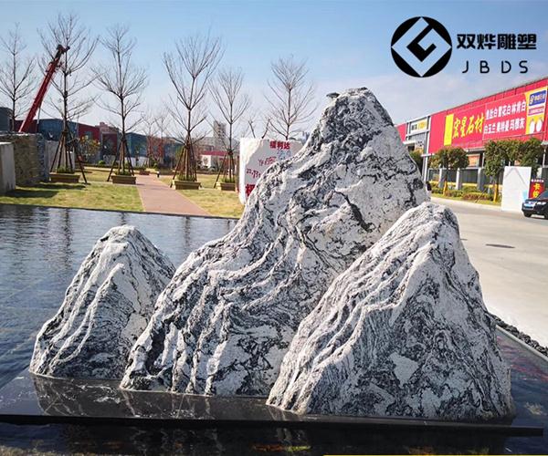 小型枯山水庭院景观假山石头雪浪石切片造景图片